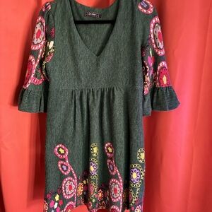 Cute green dress with beautiful stitch detail.